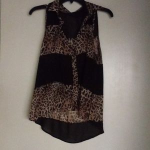 Sleeveless shear tiger print top. Great with jeans